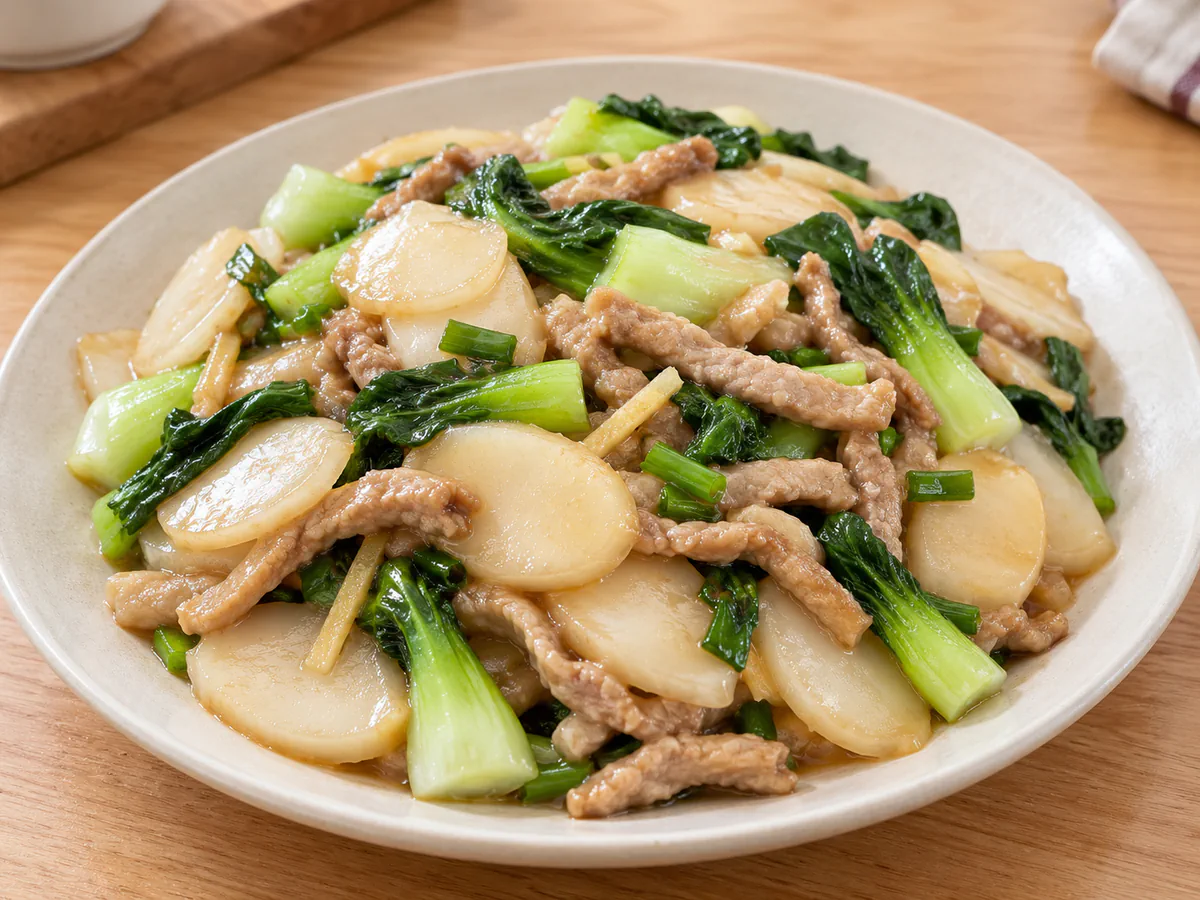 Stir-fried rice cakes with pork and bok choy
